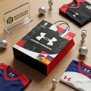 काले और लाल शॉपिंग पेपर बैग Under Armour लोगो और रंगीन पैटर्न के साथ, उपहार, रिटेल, या खाद्य पैकेजिंग के लिए उपयुक्त, OEM/ODM सेवा उपलब्ध
