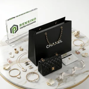 Sac en papier noir avec poignée en chaîne et logo imprimé pour l'emballage de cadeaux ou de vente au détail, adapté aux bijoux ou aux produits cosmétiques, service OEM/ODM disponible