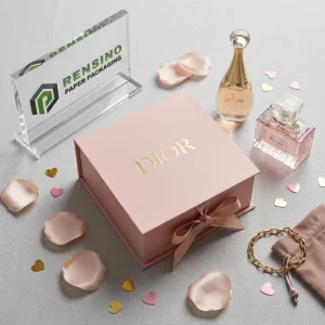 Boîte cadeau en papier de marque DIOR rose avec nœud en ruban, adaptée pour l'emballage de cadeaux ou de détail, impression de logo personnalisée disponible