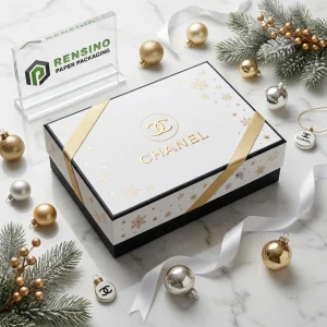 Caja de regalo de papel rígido blanco y negro de CHANEL con patrón de copo de nieve dorado, adecuada para empaques de regalo o venta al por menor, impresión de logo personalizada disponible