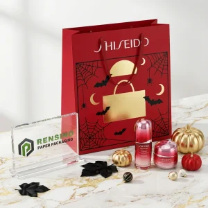 Bolsa de regalo de papel roja con impresión temática de Halloween y acentos dorados, adecuada para embalaje de regalos, venta al por menor o cosméticos, servicio OEM/ODM disponible