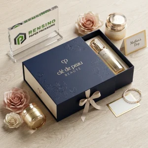caja de papel estilo cajón de clé de peau BEAUTE en azul marino con patrón floral en relieve, adecuada para empaques de cosméticos o regalos, servicio OEM/ODM disponible