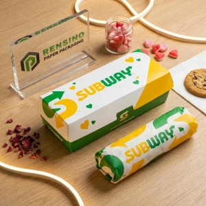 Boîte d'emballage alimentaire jetable verte et jaune avec texte “SUBWAY” imprimé et motif de cœur, adaptée à l'emballage alimentaire, design personnalisé disponible