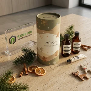 Printed Green and Beige Fabric Paper Tube Packaging with Gingerbread and Snowflake Pattern, Suitable for Fabric or Gift Packaging, Custom Logo Printing Available