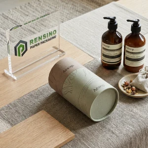 Printed Kraft and Green Fabric Paper Tube Packaging with Decorative Line Art, Suitable for Fabric or Gift Packaging, Custom Logo Printing Available