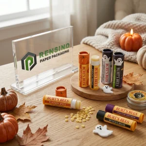 Orange and Black Paper Lip Balm Tube Packaging with Pumpkin and Ghost Illustrations, Suitable for Cosmetic Use, Custom Logo Printing Available