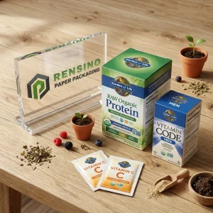 Caja de embalaje de papel verde y azul con texto impreso ‘Jardín de la Vida’ e imágenes de suplementos orgánicos, adecuada para embalaje de alimentos o farmacéutico, servicio OEM/ODM disponible