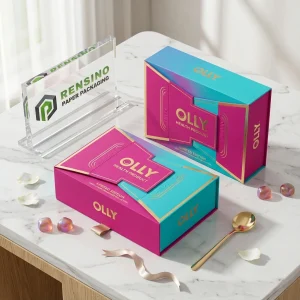 Bunte Pappbox mit bedrucktem “OLLY”-Text und limitiertem Muster, geeignet für Geschenke, Lebensmittel oder Einzelhandelsverpackungen, individuelle Gestaltung verfügbar