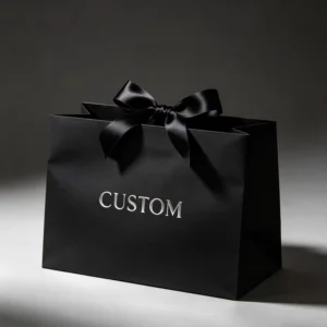 Black Matte Custom Logo Printed Paper Gift Bags with Satin Bow Ribbon Handles for Boutique and Jewelry Packaging