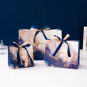 Blue Floral Paper Gift Bags with Gold Ribbon Handles for Wedding and Birthday Favors