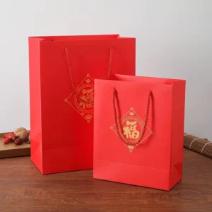Chinese New Year Red Paper Gift Bags with Offset Printing, Gold Foil, Blessing Design, and Drawstring Ribbon, Biodegradable and Recyclable