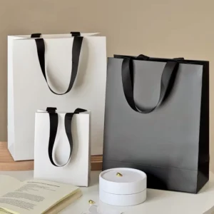 Custom Eco-Friendly Paper Gift Bag with Ribbon Handle and Matte Lamination for Candle and Craft Packaging