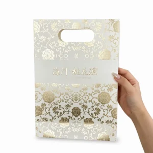 Custom Full Surface Gold Hot Stamping Paper Bag Embossed Logo OEM Glossy Finish Luxury Gift Bag
