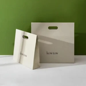 Custom Kraft Paper Bags for Clothing and Cosmetics with Hollow-Out Design and Printed Logo