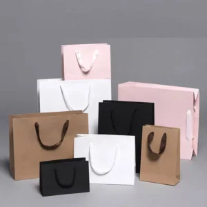 Custom Logo Printing Light Deep Pink Paper Gift Bag with UV Glossy Gold Finish for Clothing, Shoes, Accessories, and Perfume