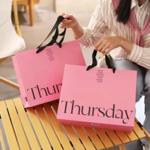 Custom Logo Reusable Pink Paper Gift Bags with Handles for Clothes