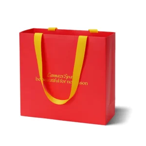 Eco-Friendly Kraft Paper Gift Bag with Ribbon Handle and Foil Logo Printing for Candle Packaging
