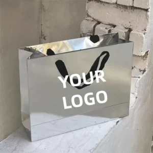 High Quality Luxury Metallic Silver Paper Bags Lamination Custom Logo Ribbon Handle Tote Bags for Clothing Packaging Foldable
