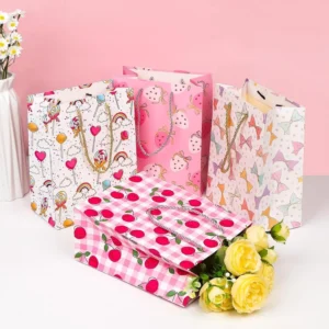 Medium 4-Piece 9-inch White and Pink Cartoon Gift Bags with Rope Handles and Tissue Paper for Birthday and Christmas Gifts