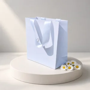Blank Matte Laminated White Card Paper Bag with Satin Ribbon Handle and Reinforced Side Tab