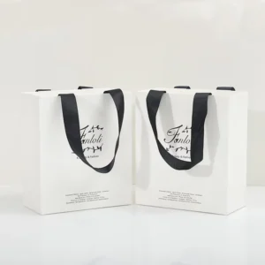 Custom Eco-Friendly White Card Paper Bag with Gold Foil Logo and Handle for Clothing and Garment Packaging