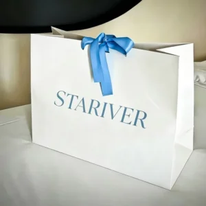 Custom Printed White Paper Carrier Bag with Blue Satin Bow for Apparel and Gift Packaging