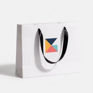 Eco-Friendly White Cardboard Gift Bag with Custom Color Printing and Ribbon Handle for Cosmetic Shop Packaging