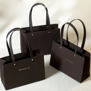 Luxury Dark Brown Paper Gift Bag PU Handle Gold Rivet Hot Stamping Logo Custom Tote Bag For Wedding Birthday Party Packaging