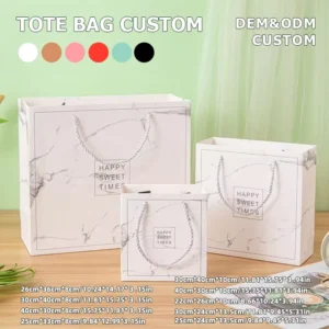 Reusable Custom White Cardboard Paper Bag with Gold Foil and Ribbon for Garment Store Packaging