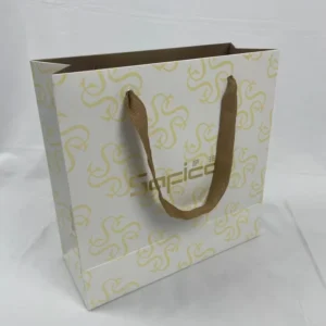White Card Paper Bag with Custom Gold-Stamped Logo, All-Over Print, Thick Fabric Handle, and Gift Packaging
