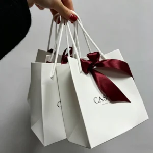 White Luxury Paper Gift Bag Burgundy Satin Bow Rope Handle Custom Logo Shopping Bag for Jewelry Cosmetic Boutique